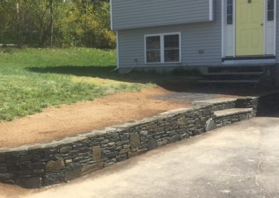 Stone retaining wall in Spencer MA by Stone Builders Masonry
