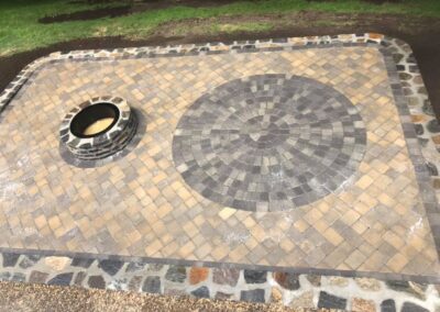 Top View patio and firepit by Stone Builders Masonry
