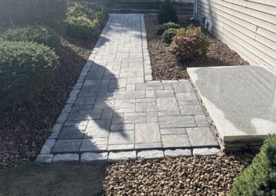 Paver and cobblestone walkway in Holden by Stone Builders Masonry