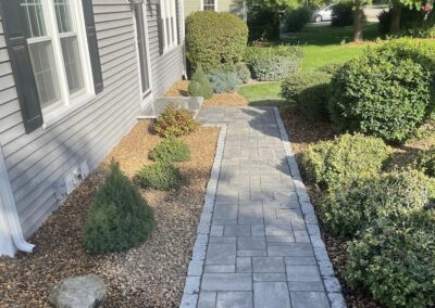 Paver and cobblestone walkway in Holden by Stone Builders Masonry