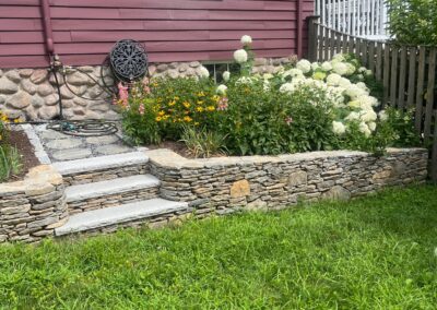 Holden raised garden wall with steps to hose access