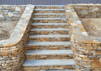 steps with granite treads by Stone Builders Masonry